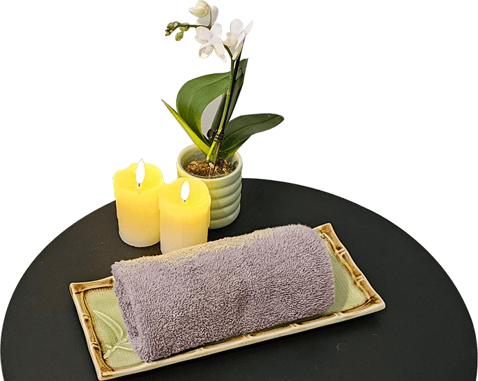 A table with candles and towels on it